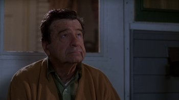 Movie still from “Grumpier Old Men” (1995), directed by Howard Deutch – An older man wearing a brown sweater looking off into the distance; Close Up shot, Low angle