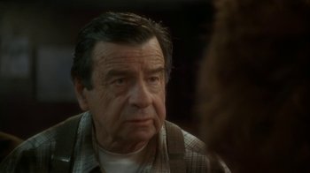 Movie still from “Grumpier Old Men” (1995), directed by Howard Deutch – An older man is looking at the camera; Close Up shot, Over the shoulder angle