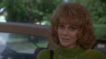Movie still from “Grumpier Old Men” (1995), directed by Howard Deutch – A person wearing a green sweater; Close Up shot, Over the shoulder angle