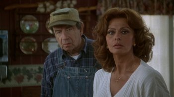 Movie still from “Grumpier Old Men” (1995), directed by Howard Deutch – An older man and a younger woman standing next to each other; Close Up shot, Over the shoulder angle
