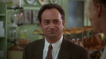 Movie still from “Grumpier Old Men” (1995), directed by Howard Deutch – A person wearing a suit and tie; Close Up shot, Low angle