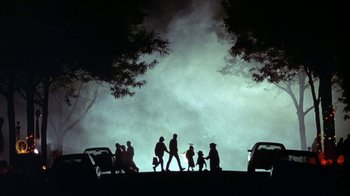 Movie still from “Grumpier Old Men” (1995), directed by Howard Deutch – A group of people standing on top of a hill at night; Extreme Wide shot, Low angle