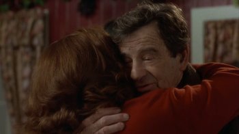 Movie still from “Grumpier Old Men” (1995), directed by Howard Deutch – An older man and a younger woman hugging each other; Close Up shot, Over the shoulder angle