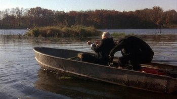 Movie still from “Grumpier Old Men” (1995), directed by Howard Deutch – Two people in a boat fishing on a lake; Wide shot, High angle