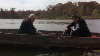 Movie still from “Grumpier Old Men” (1995), directed by Howard Deutch – Two people in a boat on a river; Wide shot, High angle