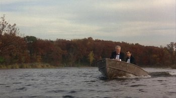 Movie still from “Grumpier Old Men” (1995), directed by Howard Deutch – Two men in a boat on a river; Extreme Wide shot, High angle