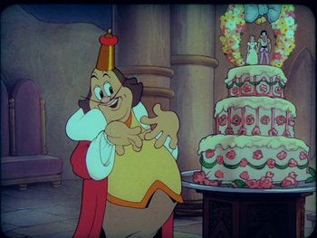 Movie still from “Gulliver's Travels” (1939), directed by William Henning – A cartoon of a man in a party hat and holding a cake; Wide shot, Over the shoulder angle