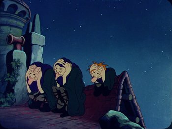 Movie still from “Gulliver's Travels” (1939), directed by William Henning – A group of people sitting next to each other on the ground; Wide shot, Overhead angle