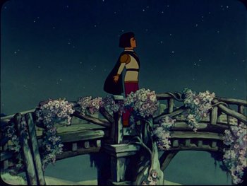 Movie still from “Gulliver's Travels” (1939), directed by William Henning – A person standing on top of a wooden bridge at night; Wide shot, Low angle