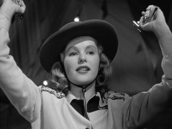 Movie still from “Gun Crazy” (1950), directed by Joseph H. Lewis – A black and white photo of a woman wearing a cowboy hat; Close Up shot, Low angle