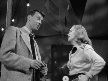 Movie still from “Gun Crazy” (1950), directed by Joseph H. Lewis – A man and a woman talking to each other; Medium shot, Low angle