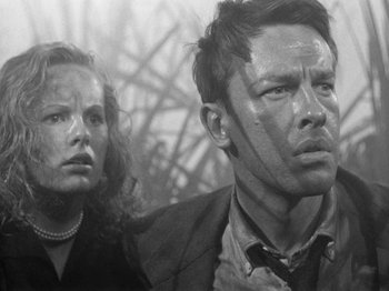 Movie still from “Gun Crazy” (1950), directed by Joseph H. Lewis – A black and white photo of a man and a woman; Close Up shot, Low angle