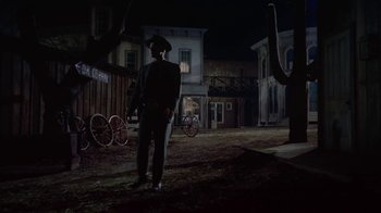 Movie still from “Gunfight at the O.K. Corral” (1957), directed by John Sturges – A man standing in the middle of an empty street; Wide shot, Low angle