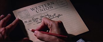 Movie still from “Gypsy” (1962), directed by Mervyn LeRoy – A person writing on a piece of paper; Extreme Close Up shot, High angle