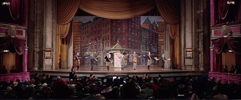 Movie still from “Gypsy” (1962), directed by Mervyn LeRoy – A group of people on a stage performing a show; Extreme Wide shot, High angle