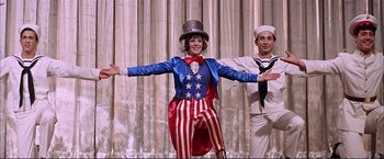 Movie still from “Gypsy” (1962), directed by Mervyn LeRoy – A man and a woman dressed in patriotic costumes; Medium shot, Low angle