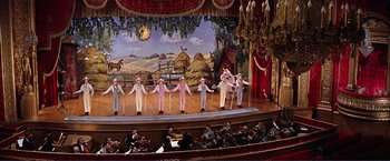 Movie still from “Gypsy” (1962), directed by Mervyn LeRoy – A group of men on a stage with musical instruments; Wide shot, High angle
