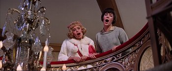 Movie still from “Gypsy” (1962), directed by Mervyn LeRoy – Two women singing on a stage in a theater; Medium shot, Low angle