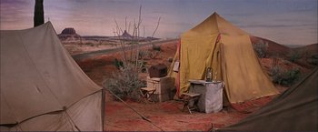 Movie still from “Gypsy” (1962), directed by Mervyn LeRoy – A tent in the middle of a desert; Wide shot, High angle