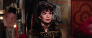 Movie still from “Gypsy” (1962), directed by Mervyn LeRoy – A person wearing a jacket; Close Up shot, Over the shoulder angle