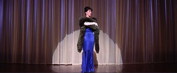 Movie still from “Gypsy” (1962), directed by Mervyn LeRoy – A woman in a blue dress on a stage; Wide shot, Low angle