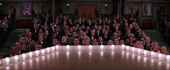 Movie still from “Gypsy” (1962), directed by Mervyn LeRoy – A group of people sitting in front of a stage; Wide shot, High angle