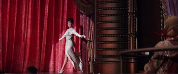 Movie still from “Gypsy” (1962), directed by Mervyn LeRoy – A woman in a silver dress on a stage; Wide shot, Low angle