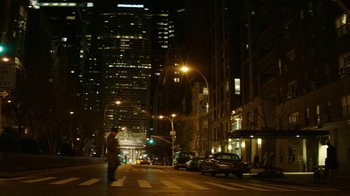 Movie still from “Hands of Stone” (2016), directed by Jonathan Jakubowicz – A man is walking down the street at night; Extreme Wide shot, High angle