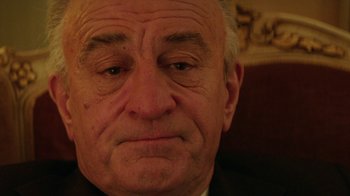 Movie still from “Hands of Stone” (2016), directed by Jonathan Jakubowicz – An older man is looking at the camera; Close Up shot, Low angle