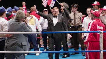 Movie still from “Hands of Stone” (2016), directed by Jonathan Jakubowicz – A group of people standing in a boxing ring; Wide shot, High angle