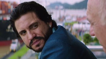 Movie still from “Hands of Stone” (2016), directed by Jonathan Jakubowicz – A person wearing a blue shirt; Close Up shot, Over the shoulder angle