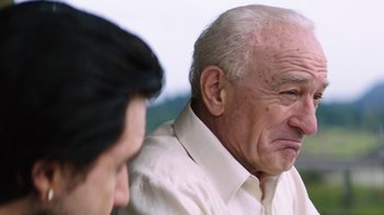 Movie still from “Hands of Stone” (2016), directed by Jonathan Jakubowicz – An older man is looking at a younger man; Close Up shot, Over the shoulder angle