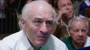 Movie still from “Hands of Stone” (2016), directed by Jonathan Jakubowicz – An old man with a white beard and a white shirt; Close Up shot, Low angle