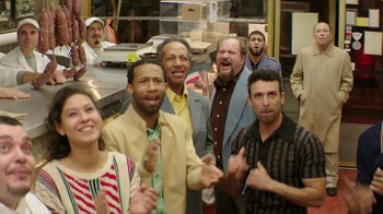 Movie still from “Hands of Stone” (2016), directed by Jonathan Jakubowicz – A group of men and women standing in front of a counter; Medium shot, Low angle