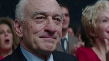 Movie still from “Hands of Stone” (2016), directed by Jonathan Jakubowicz – An older man in a suit and tie; Close Up shot, Over the shoulder angle