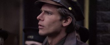 Movie still from “Hanover Street” (1979), directed by Peter Hyams – A person wearing a hat; Close Up shot, Low angle