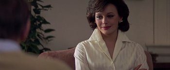 Movie still from “Hanover Street” (1979), directed by Peter Hyams – A person wearing a white shirt; Close Up shot, Over the shoulder angle