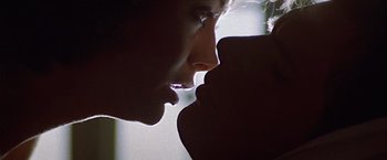 Movie still from “Hanover Street” (1979), directed by Peter Hyams – A man's face with his hand on his face; Extreme Close Up shot, Low angle