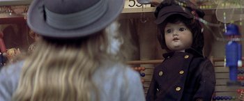 Movie still from “Hanover Street” (1979), directed by Peter Hyams – Two dolls are standing next to each other; Close Up shot, Over the shoulder angle