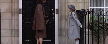 Movie still from “Hanover Street” (1979), directed by Peter Hyams – Two women standing in front of a building; Medium shot, Over the shoulder angle