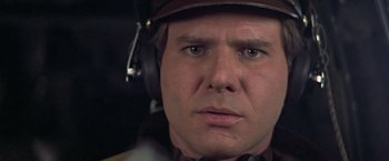 Movie still from “Hanover Street” (1979), directed by Peter Hyams – A person wearing a headset; Close Up shot, Low angle