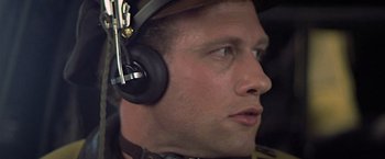 Movie still from “Hanover Street” (1979), directed by Peter Hyams – A person wearing a headset; Close Up shot, Low angle