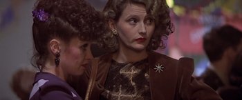 Movie still from “Hanover Street” (1979), directed by Peter Hyams – Two women are standing next to each other; Close Up shot, Over the shoulder angle