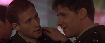 Movie still from “Hanover Street” (1979), directed by Peter Hyams – Two young men touching each other's face; Close Up shot, Low angle