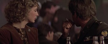 Movie still from “Hanover Street” (1979), directed by Peter Hyams – A man and a woman are sitting at a table; Close Up shot, Over the shoulder angle