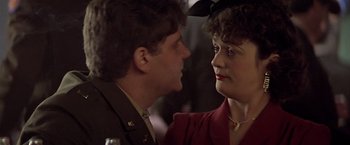 Movie still from “Hanover Street” (1979), directed by Peter Hyams – A man and a woman looking at one another; Close Up shot, Over the shoulder angle