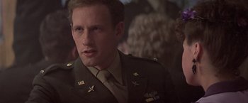 Movie still from “Hanover Street” (1979), directed by Peter Hyams – A person wearing a military uniform; Close Up shot, Low angle