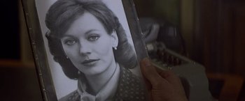 Movie still from “Hanover Street” (1979), directed by Peter Hyams – A person holding a picture of a woman; Extreme Close Up shot, High angle