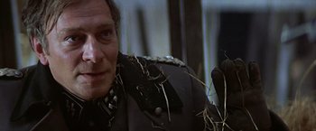 Movie still from “Hanover Street” (1979), directed by Peter Hyams – A person wearing a jacket; Close Up shot, Low angle