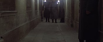 Movie still from “Hanover Street” (1979), directed by Peter Hyams – A group of people walking down a long hallway; Wide shot, High angle